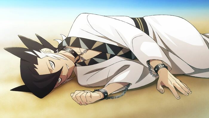 Grimsley from Pokémon lying and smiling on the ground