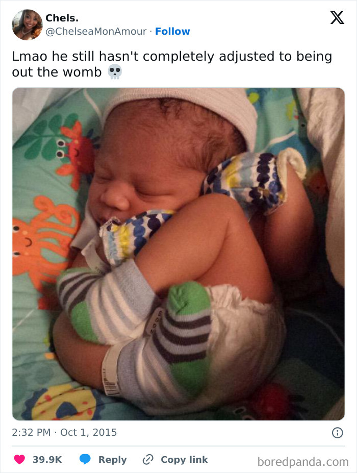 Baby curled up wearing striped socks, embodying a weird meme moment.