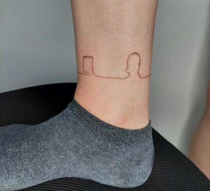 Minimalist family tattoo on ankle symbolizing unbreakable bonds.