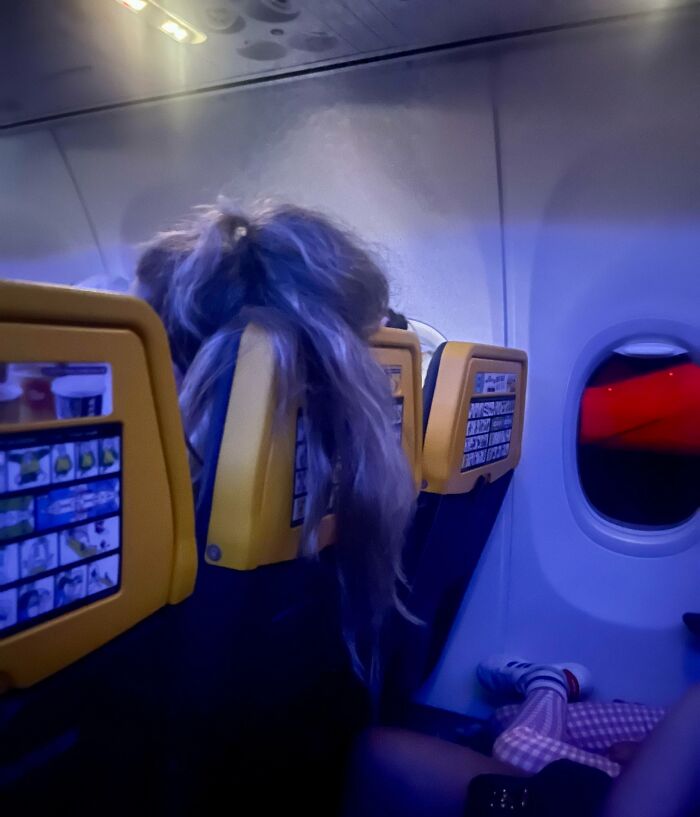 Girl Sitting In Front Of My Wife On A Flight