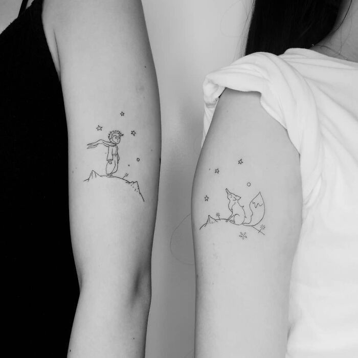 Two arms with matching family tattoos depicting The Little Prince and a fox, symbolizing unbreakable bonds.