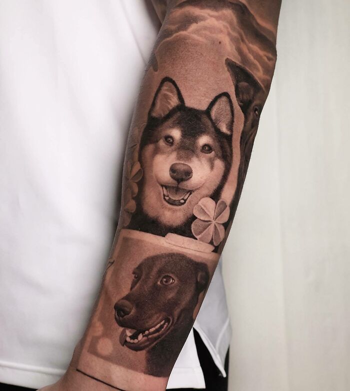 Tattoo of dogs and flowers on forearm symbolizing family bonds.
