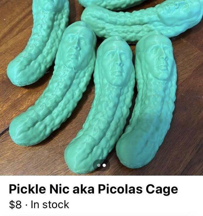 Cursed foods: Green pickles with celebrity faces on a wooden table.