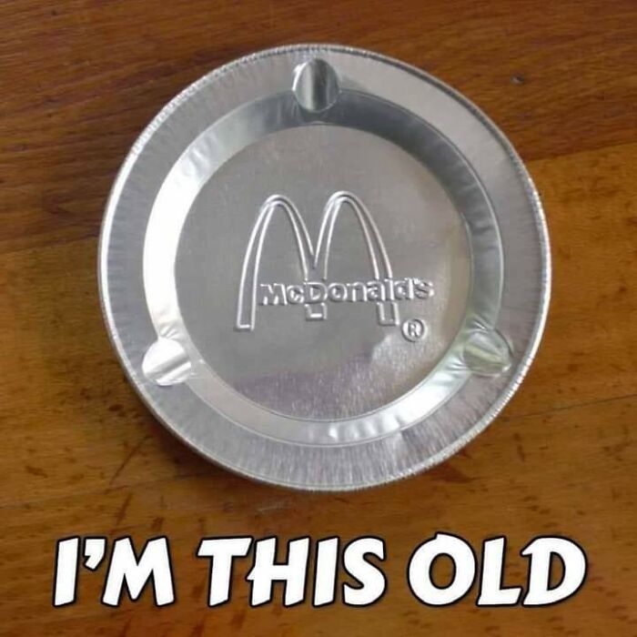 McDonald's pie tin lid on wooden table with text expressing a funny take on people getting old faster than expected