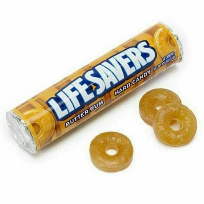 LifeSavers butterscotch hard candy with three candies outside the wrapper, a funny nod to getting old faster.
