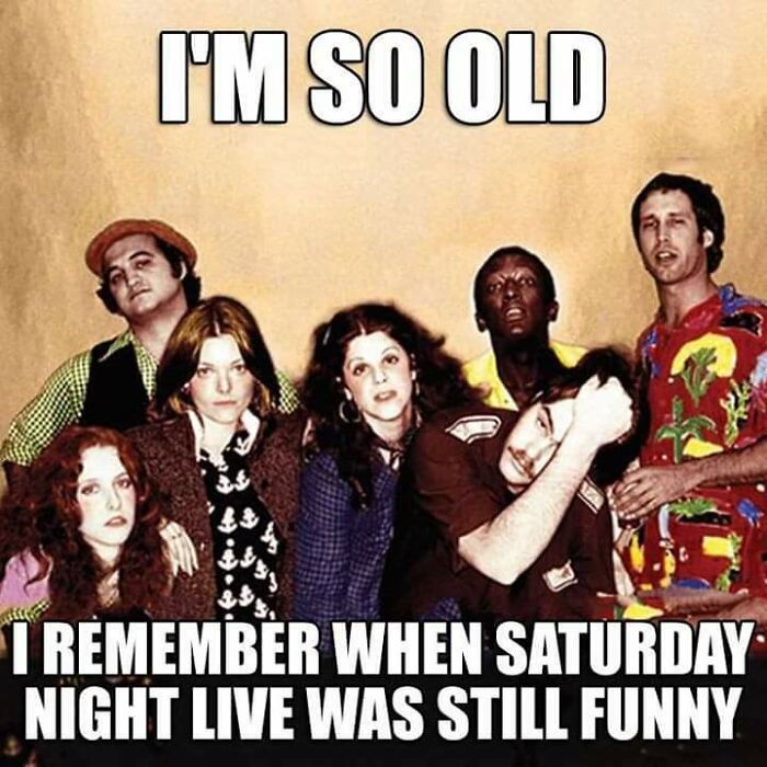 Group of people posing with text about getting old and Saturday Night Live no longer being funny, highlighting aging humor.
