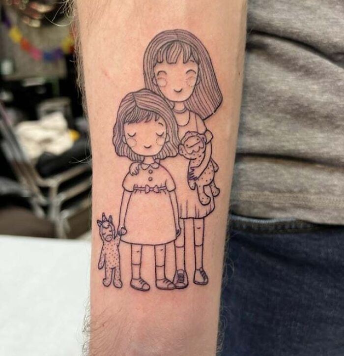 Family tattoo depicting two smiling children and a baby on an arm, symbolizing unbreakable bonds.