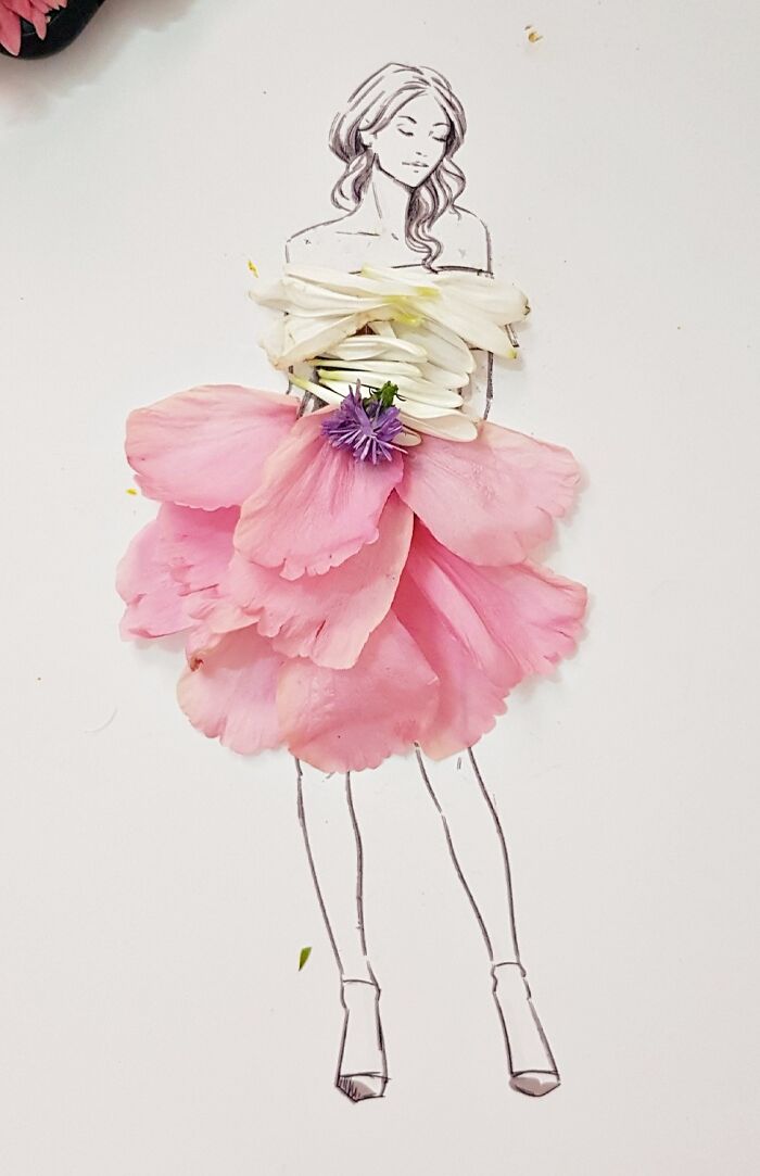A drawing of a woman dressed in real flower petal gown