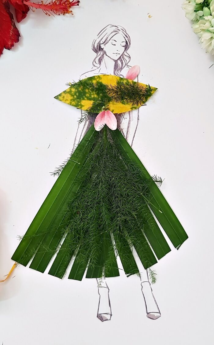 A drawing of a woman dressed in real flower petal gown