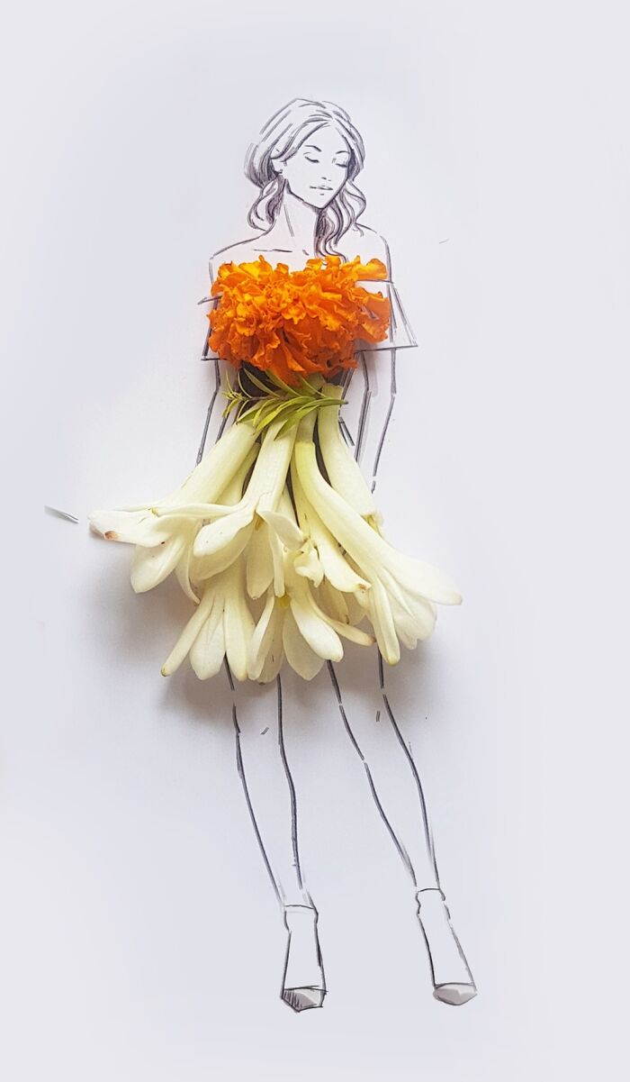 A drawing of a woman dressed in real flower petal gown