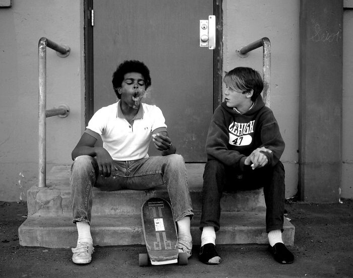 A picture of two guys smoking