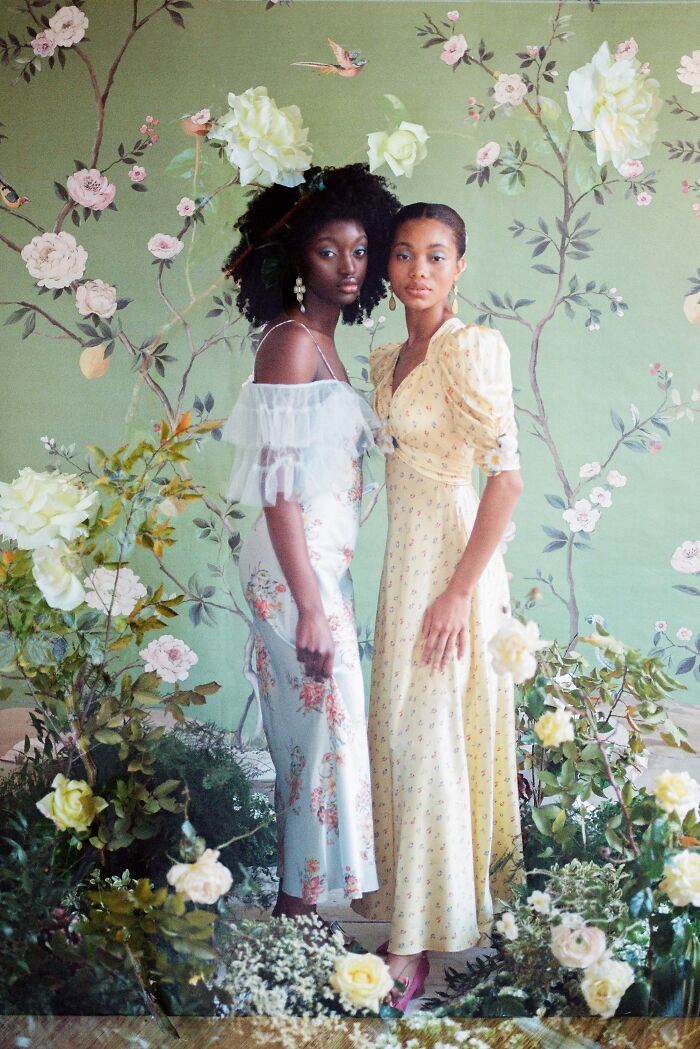 A picture of two women in floral environment