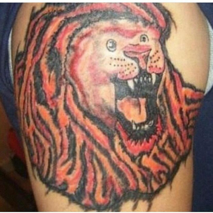 Lion tattoo with artistic mistakes, showcasing an epic failure turned lesson in ink.