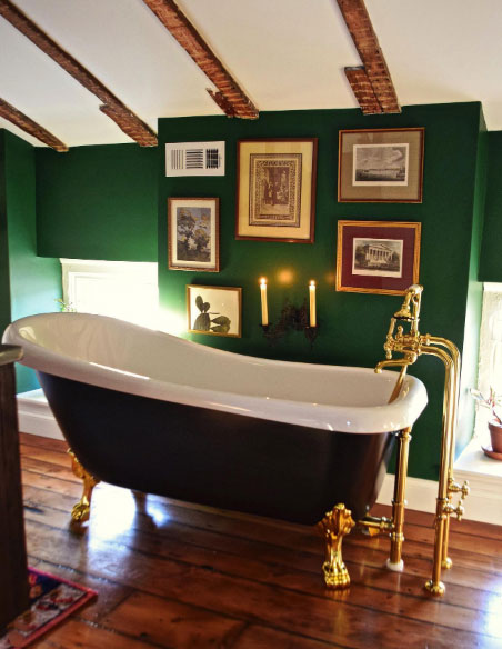 Slipper clawfoot tub in the green-wall room.