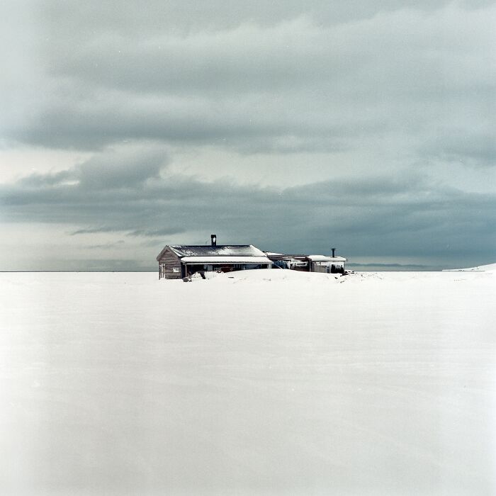 A picture of a house in snow