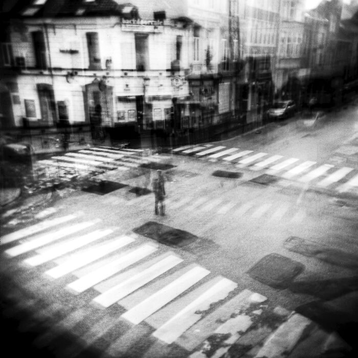 An artsy picture of a man surrounded by crossings