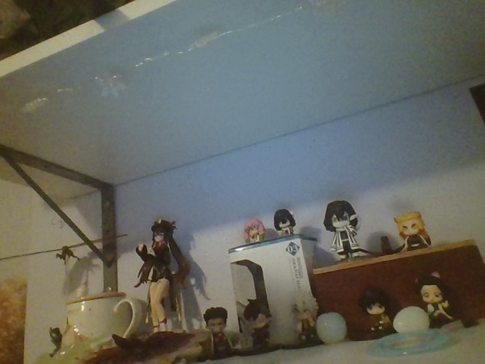 Some Kimetsu No Yaiba/Demon Slayer Mini Figures And Then A Hu Tao Figure :3