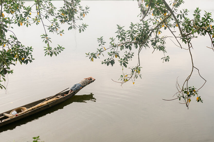 A fisherman taking a nap on his boat