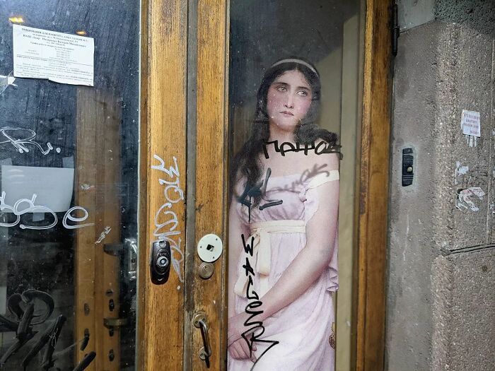 An image of a woman from "Contemplation" painting in modern surroundings