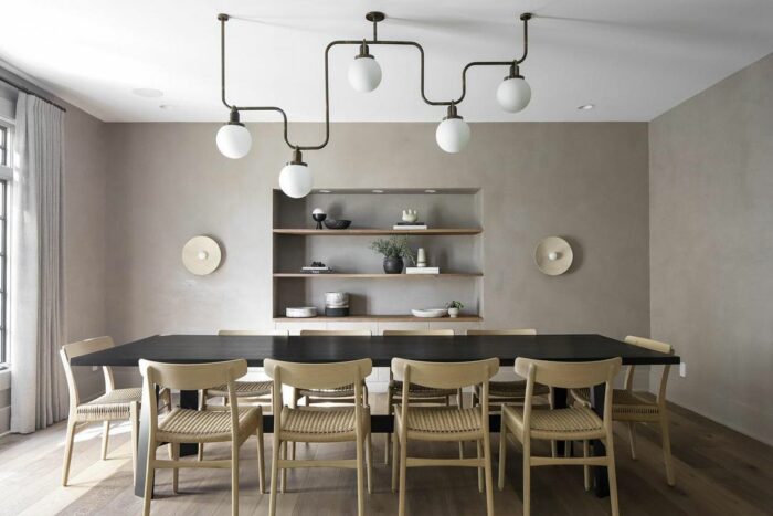 Kitchen with wooden table chairs and orb lights Kitchen with wooden table chairs and orb lights