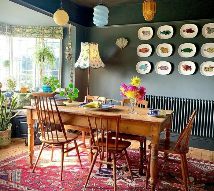 a maximalist room with a wooden dining set and animal-design wall decorations a maximalist room with a wooden dining set and animal-design wall decorations