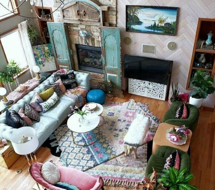 a top-down view of a maximalist living room with bold rugs, sofas, and vintage decor a top-down view of a maximalist living room with bold rugs, sofas, and vintage decor