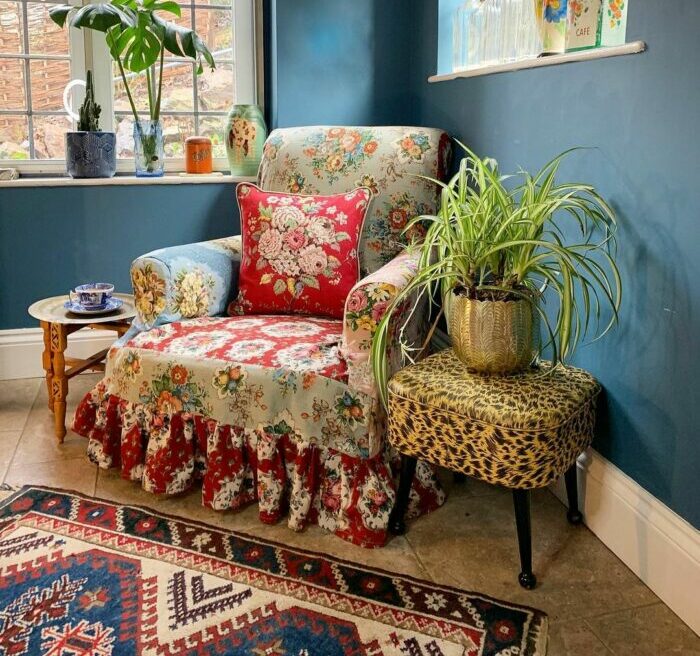 a maximalist living room with a colorful chair made of many materials and patterns a maximalist living room with a colorful chair made of many materials and patterns