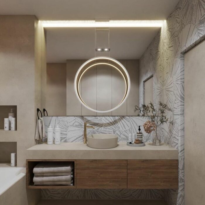 Modern bathroom featuring waterproof wallpaper with subtle leaf pattern and wooden cupboard with sink and circular light fixture.