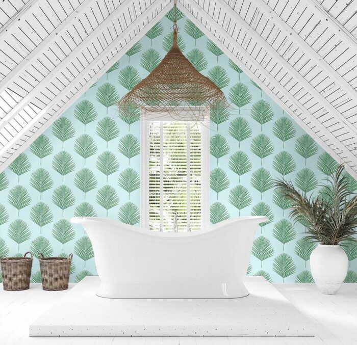 Bathroom with blue peel-and-stick fern wallpaper, featuring a white freestanding tub and rustic wicker accents.