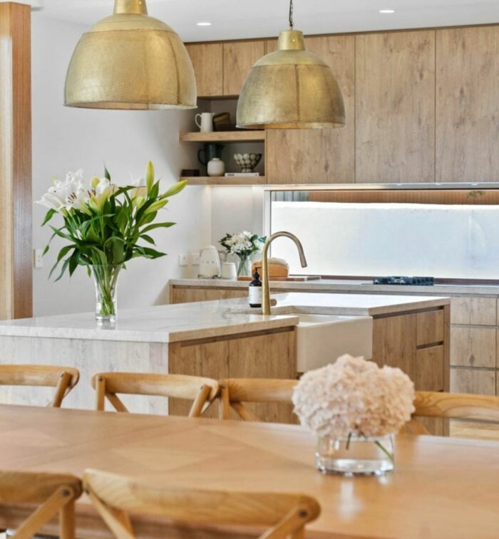 Luxury wooden kitchen with gilded lights and wooden furniture Luxury wooden kitchen with gilded lights and wooden furniture