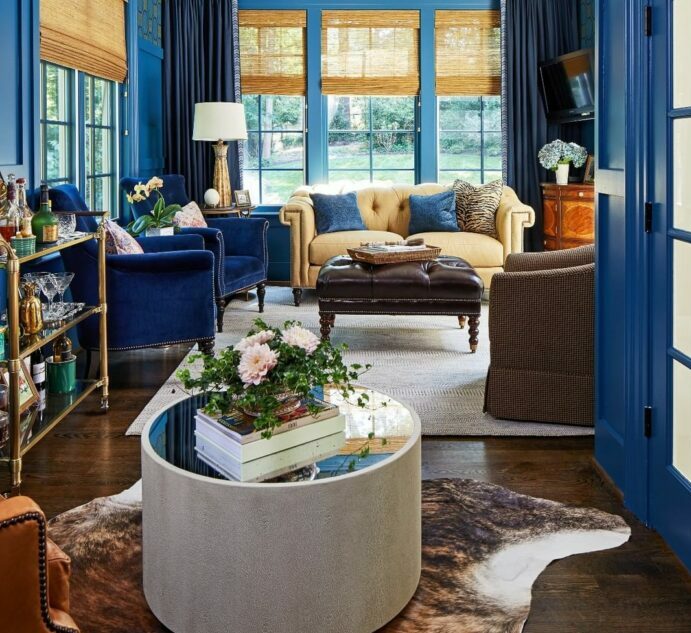 a maximalist living room with blue decor and sofas a maximalist living room with blue decor and sofas