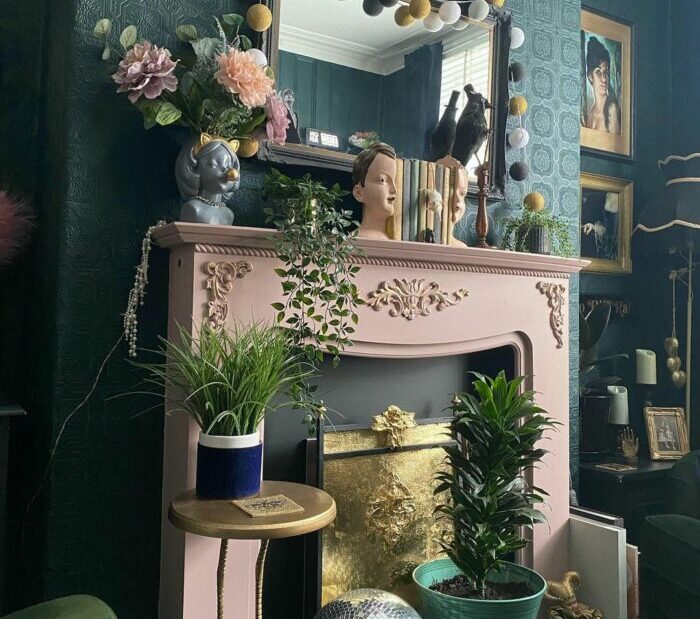 a maximalist living room with small sculptures and plants kept on a fireplace a maximalist living room with small sculptures and plants kept on a fireplace