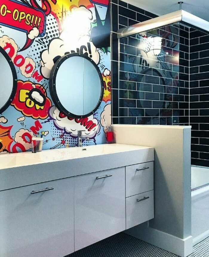 Bathroom featuring trendy graphic comic wallpaper with a white cupboard and sink to elevate your space.