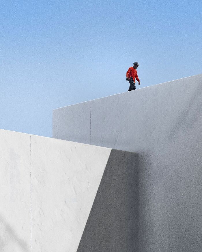 A photograph of a man walking