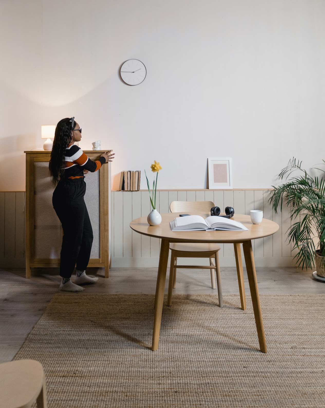 A woman walking in a tidy room
