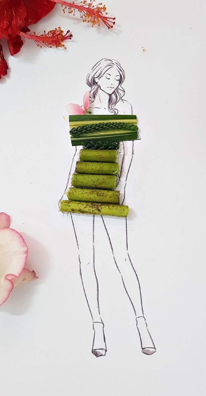 A drawing of a woman dressed in real flower petal gown