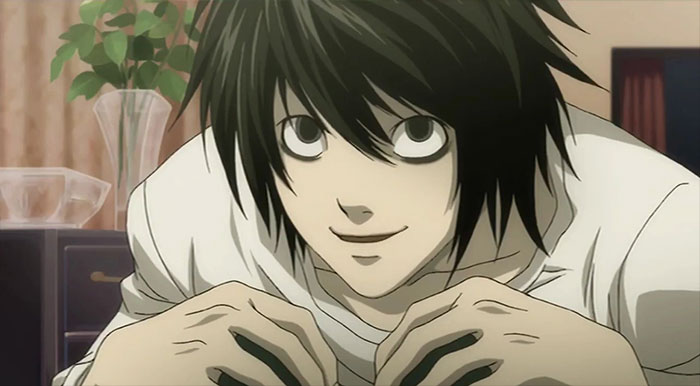 Anime character with dark hair and white shirt, smiling in a room.