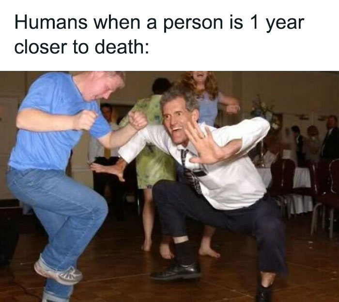 Two men dance joyfully at a party, humorously illustrating a funny birthday meme.