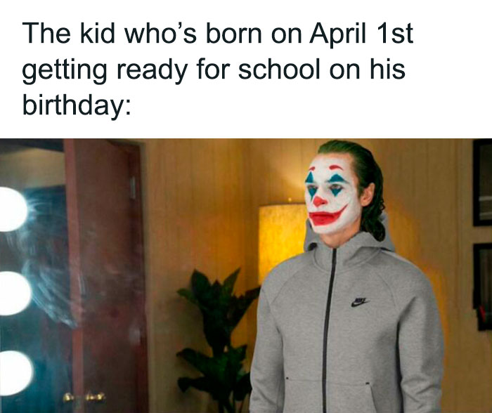 Person with clown makeup in a gray hoodie, ready for school, illustrating a funny birthday meme.