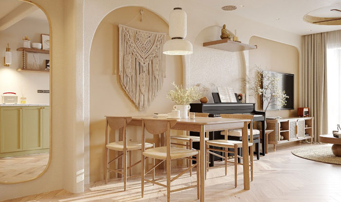 Wooden dining table and chairs with boho decor elements including macrame wall hanging and black piano in chic space.