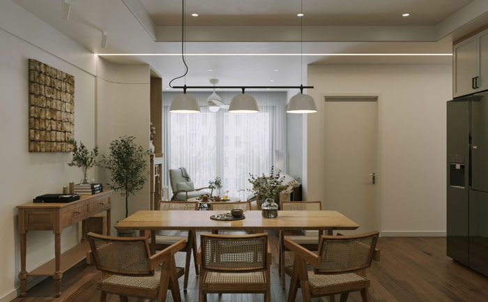 Wooden dining table with small vase and chairs showcasing unique boho decor ideas for a chic living space.