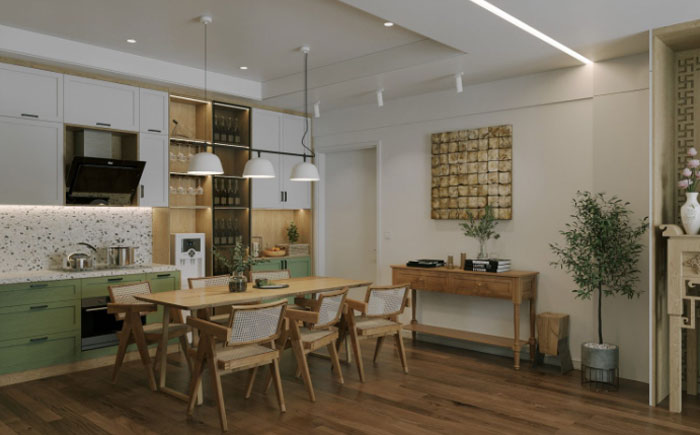 Boho decor kitchen featuring green and white cabinets with a wooden dining table and chairs for a chic space.