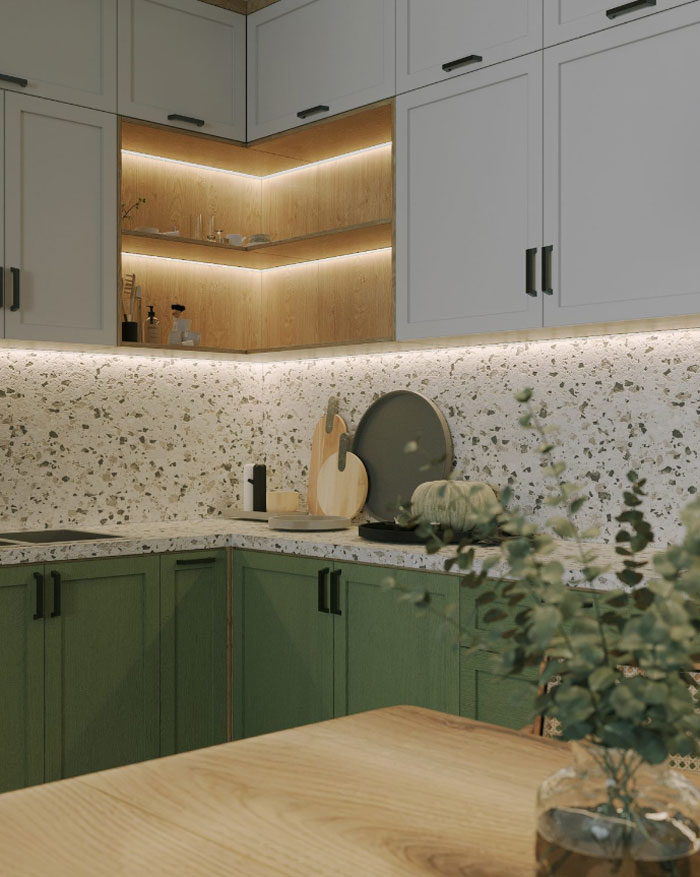 White and green kitchen cabinets with terrazzo backsplash and wood accents showcasing unique boho decor ideas for a chic space.