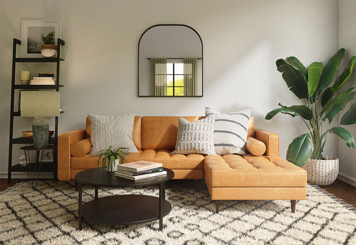Tan sectional couch with patterned pillows in a beige living room, showcasing a stylish budget-friendly cheap couch option. Tan sectional couch with patterned pillows in a beige living room, showcasing a stylish budget-friendly cheap couch option.