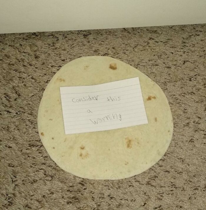 Cursed food: A tortilla on the floor with a note saying "consider this a warning."