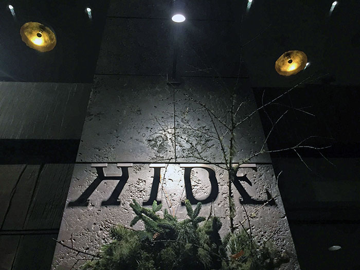 This Restaurant Sign That Is Half Shadows