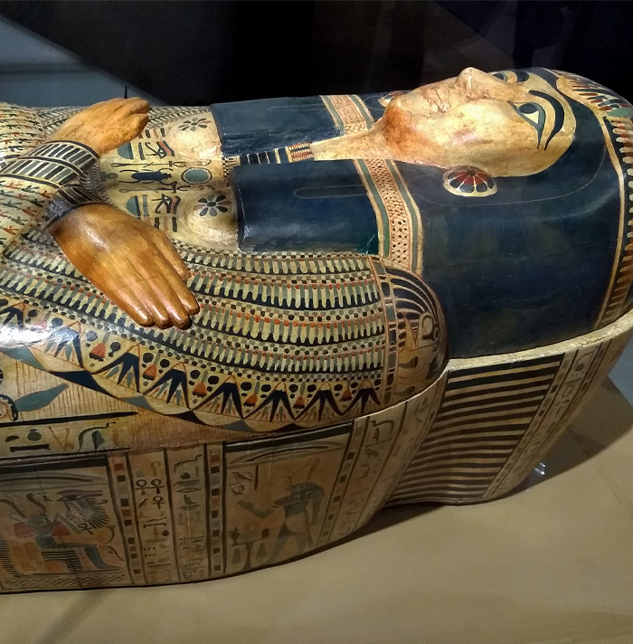 Ancient Egyptian sarcophagus with detailed hieroglyphs and painted designs, evoking scary facts and eerie history.