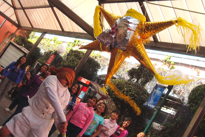 Kids breaking a colorful piñata during Las Posadas, showcasing cultural diversity and traditions around the world.