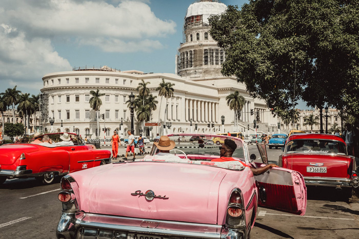 Classic cars in Havana street scene showcasing culture facts reflecting the diversity and beauty of the world.