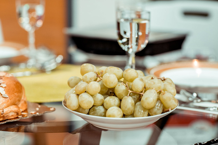 Plate of green grapes on a table showcasing culture facts reflecting the diversity and beauty of the world’s cuisine and traditions